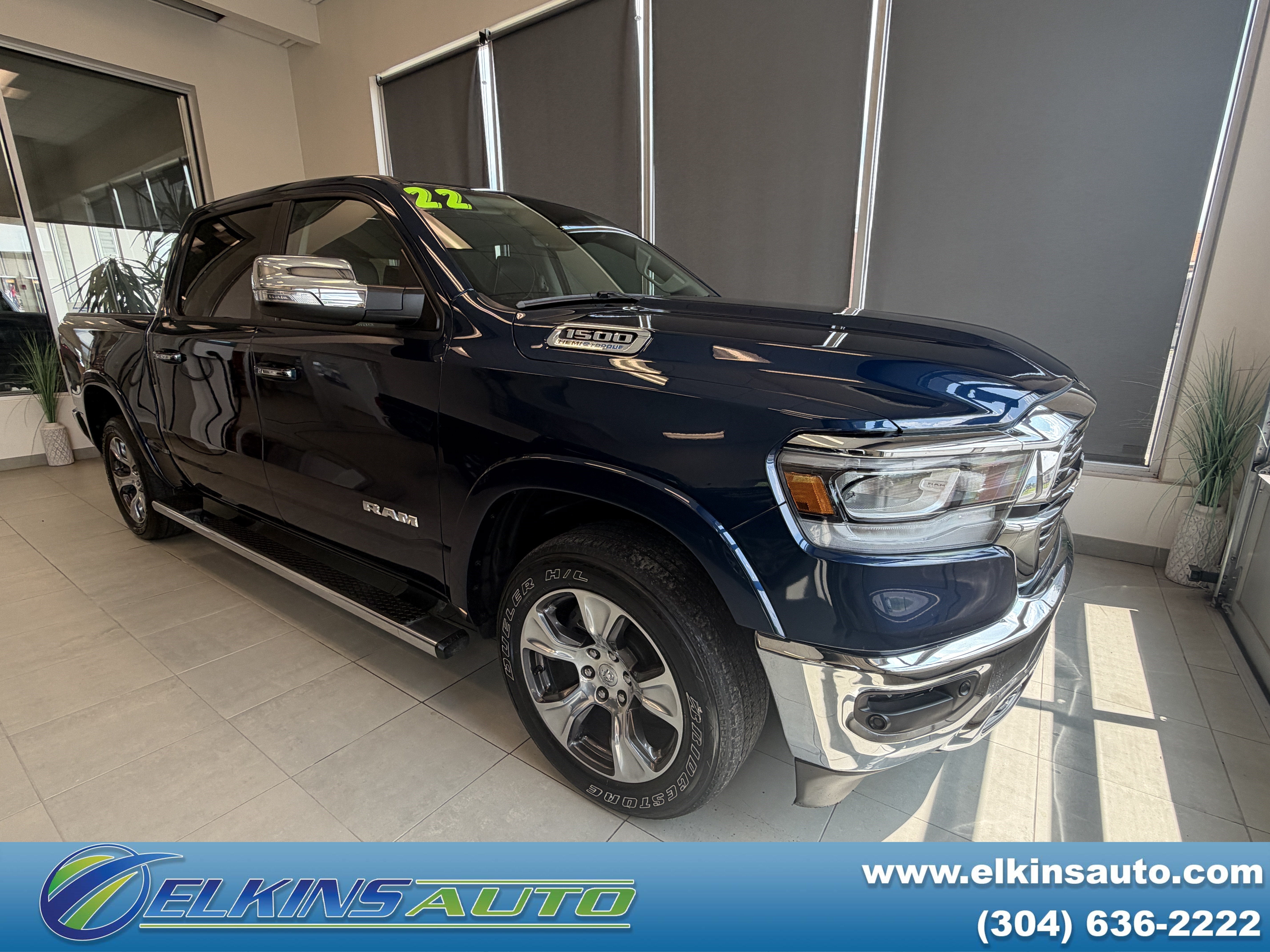 2022 RAM 1500 Laramie in Patriot Blue Pearlcoat — front three-quarter view