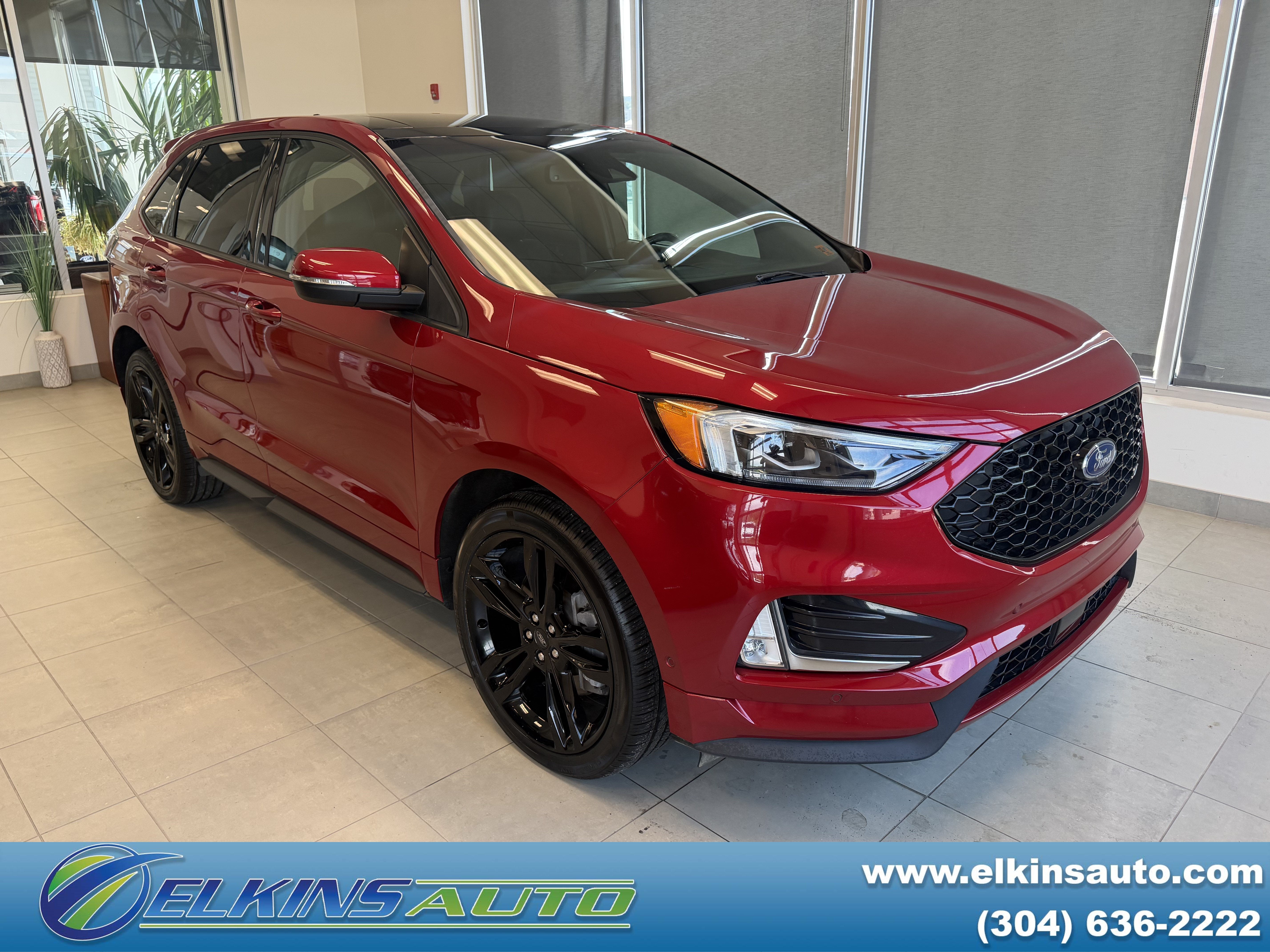 2024 Ford Edge ST in Rapid Red Metallic Tinted Clearcoat — front three-quarter view