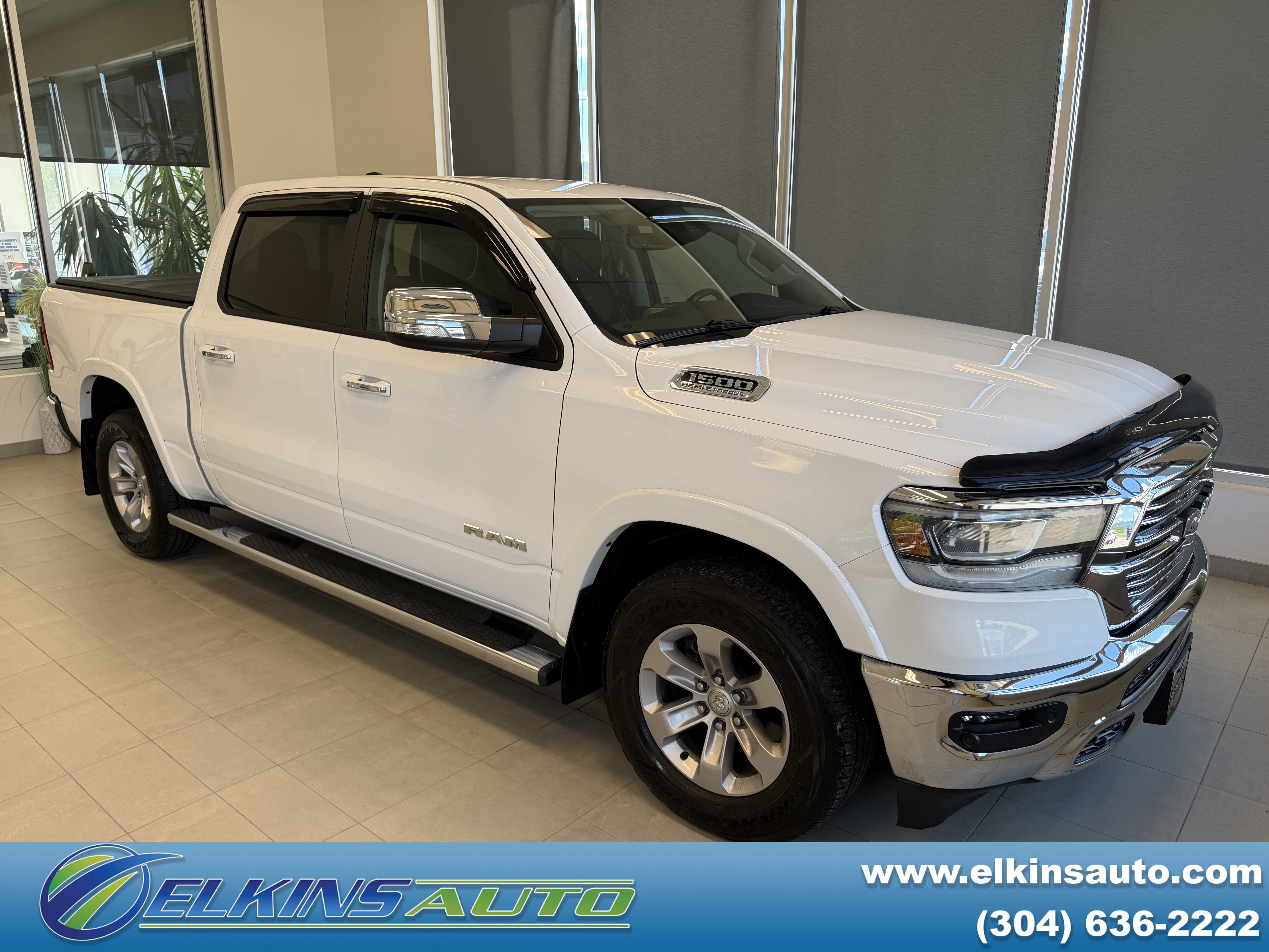 2022 RAM 1500 Laramie in Bright White Clearcoat — front three-quarter view
